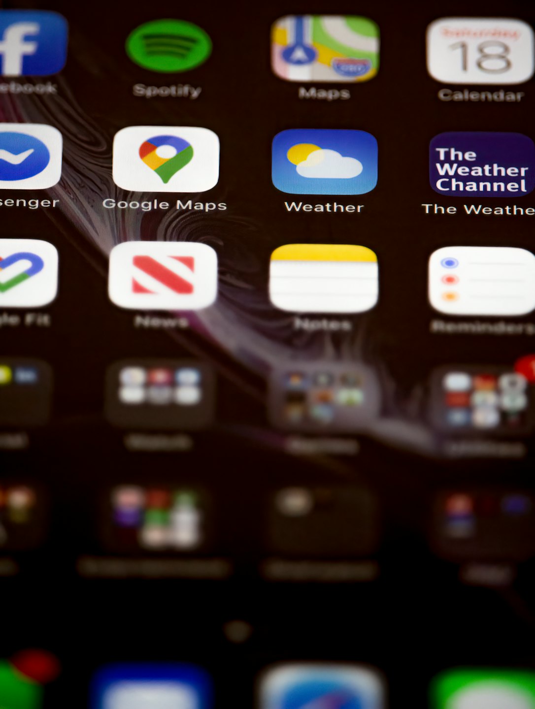 A smartphone screen displaying a grid of colorful mobile application icons.